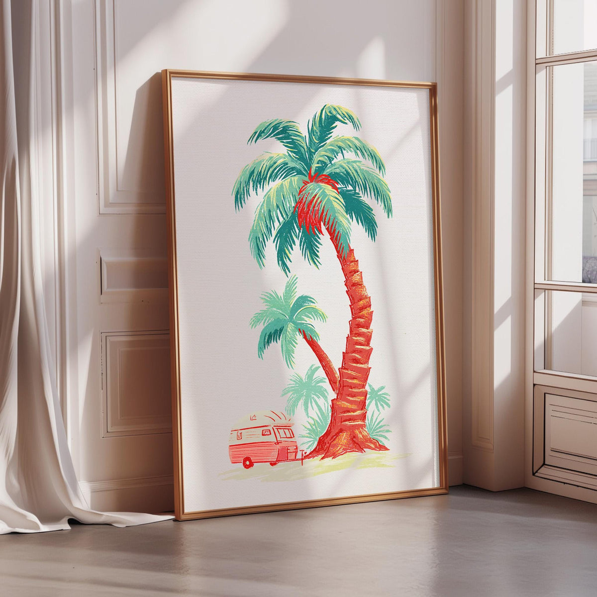 A framed illustration of a palm tree with a red RV parked underneath it, set against a white wall.
