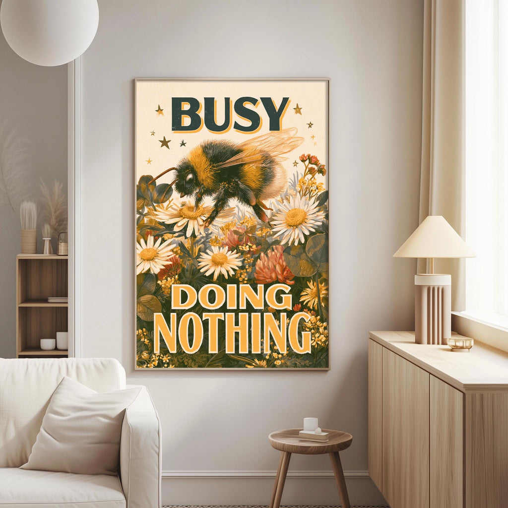 a poster with a bee and flowers, along with the text "BUSY DOING NOTHING" displayed on it.