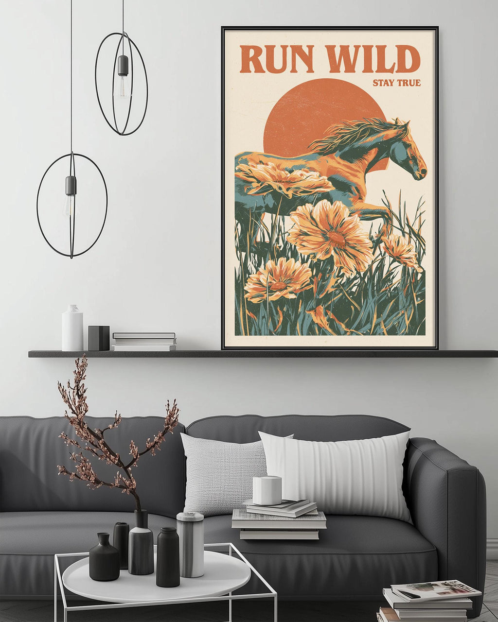 a living room with a gray sofa, a coffee table, and a framed poster of a horse and flowers on the wall.