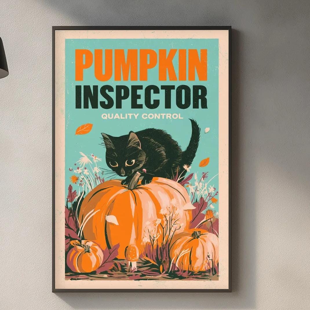 a framed poster of a black cat sitting on a pumpkin, with the text "PUMPKIN INSPECTOR QUALITY CONTROL" displayed prominently.