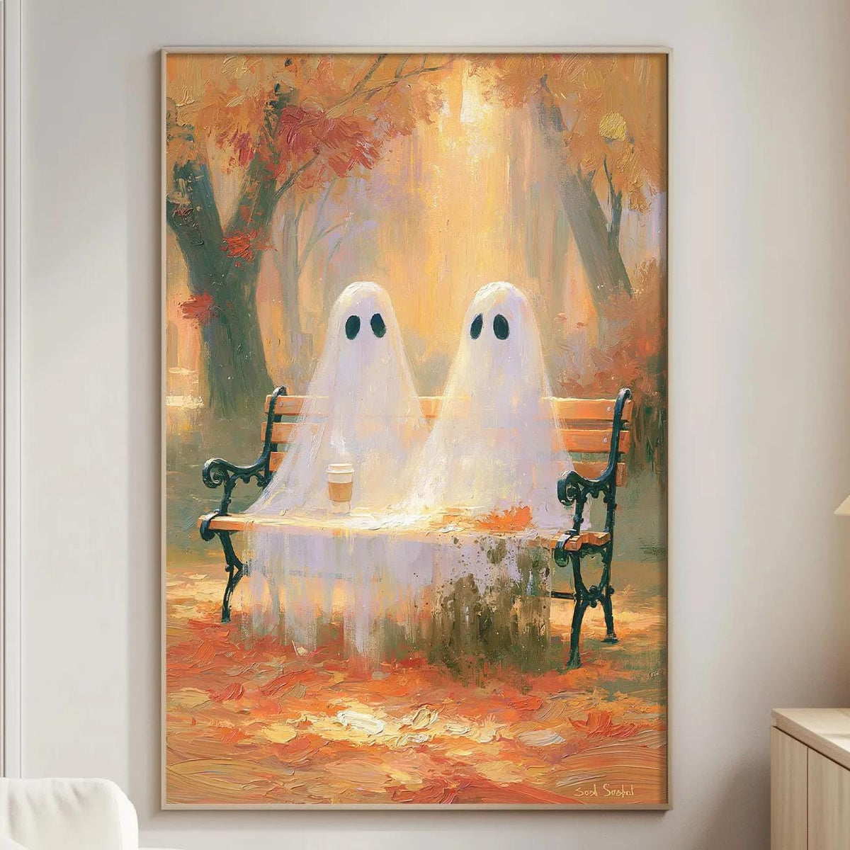 a cozy living room with a large painting of two ghostly figures sitting on a bench, surrounded by autumn foliage. The painting is hung on the wall, adding a whimsical and artistic touch to the room.