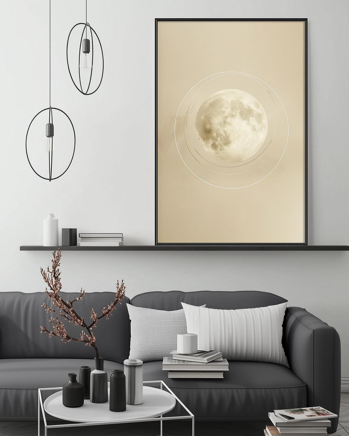 a modern living room with a gray sofa, a coffee table, and a large framed picture of a full moon on the wall.
