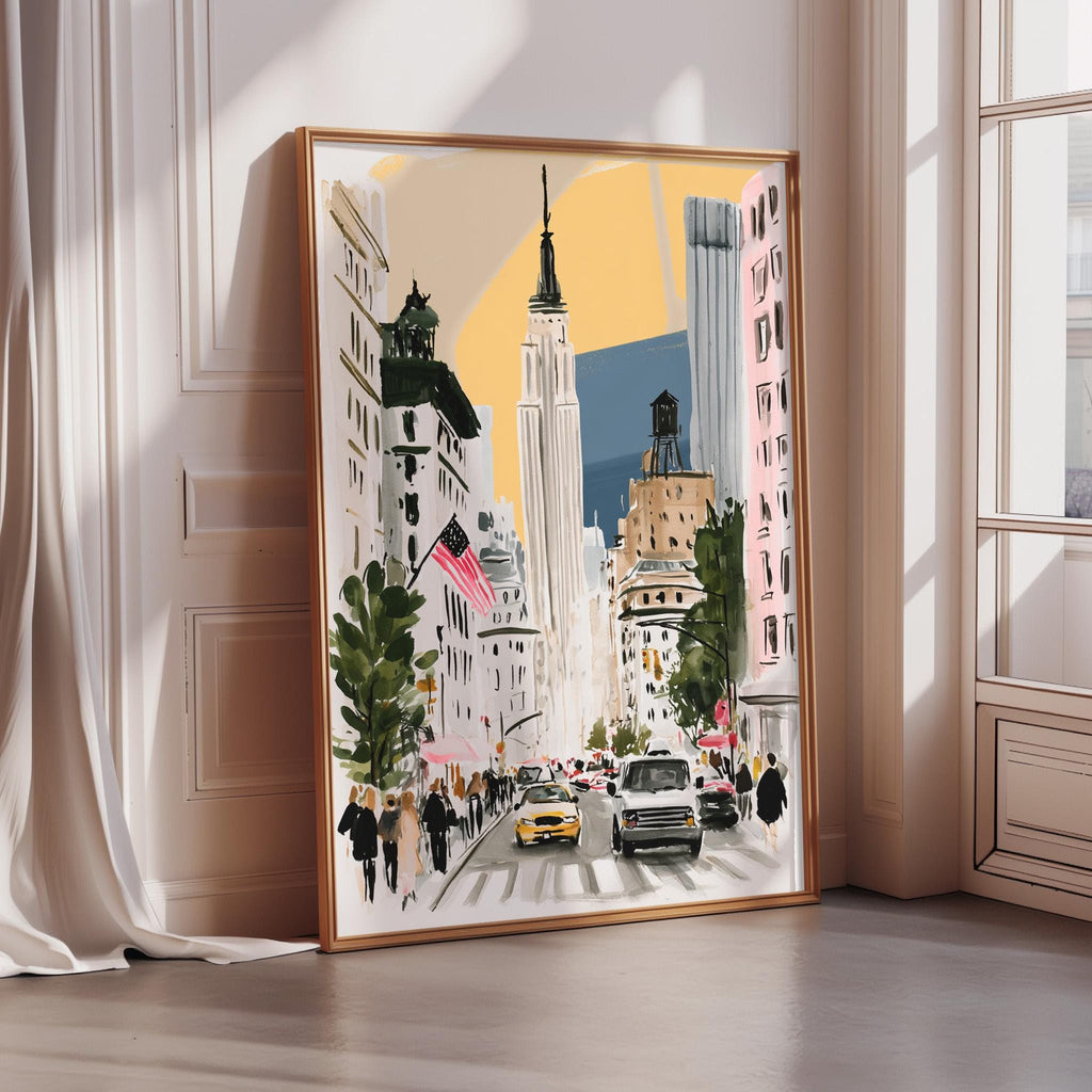 A framed painting depicting a busy city street scene with tall buildings, cars, and pedestrians.