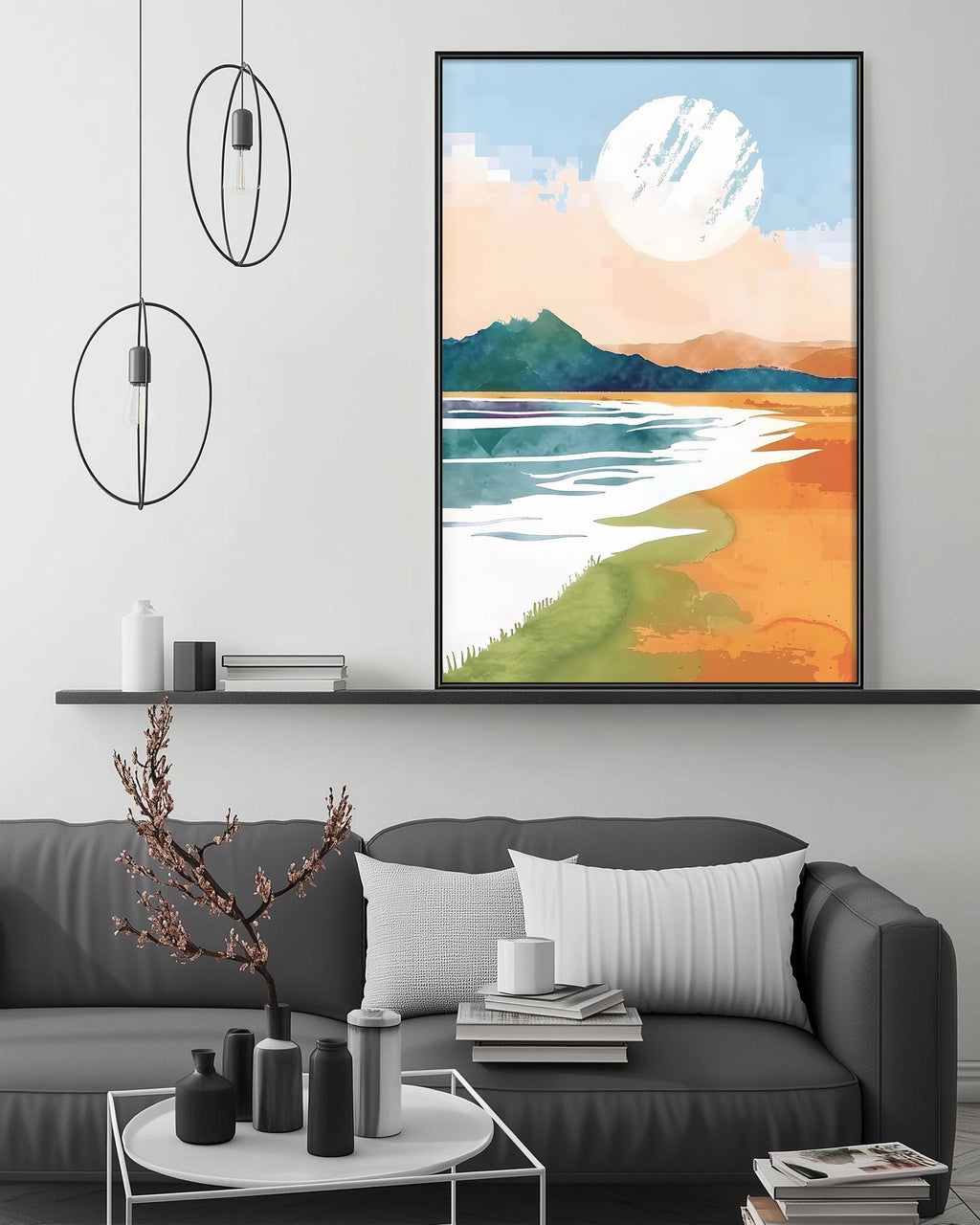 a modern living room with a gray sofa, a coffee table, and a large framed landscape painting hanging on the wall above the sofa.