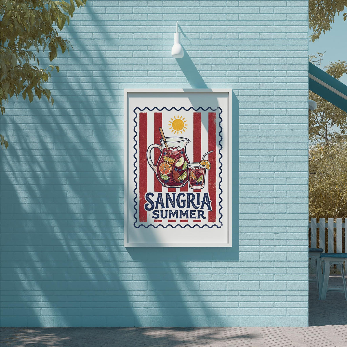 A framed poster with a vibrant design hangs on a light blue wall, featuring a red and white striped border and a sun illustration.