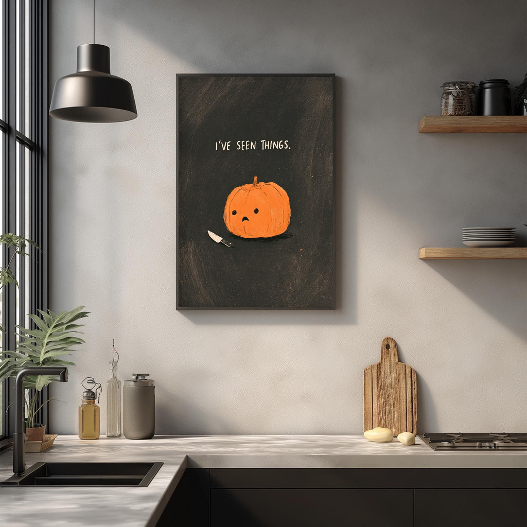 a kitchen counter with various items, including a pumpkin, a cutting board, and a plant. Above the counter, there is a framed image of a pumpkin with the text "I've seen things."