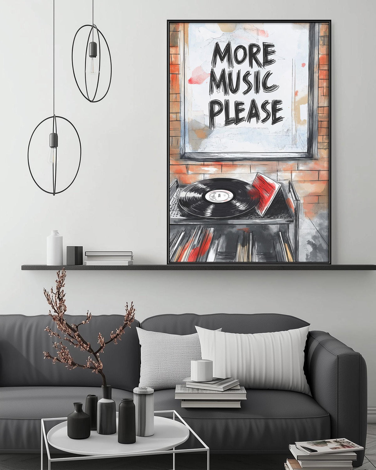 a modern living room with a gray sofa, a coffee table, and a framed poster on the wall that says "More Music Please".