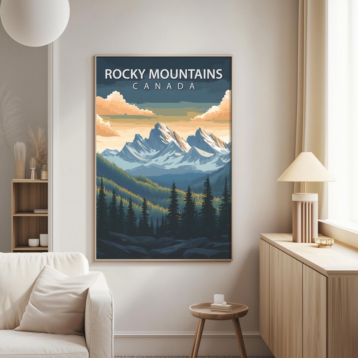 a large framed poster of Rocky Mountains in Canada hanging on a wall in a living room.