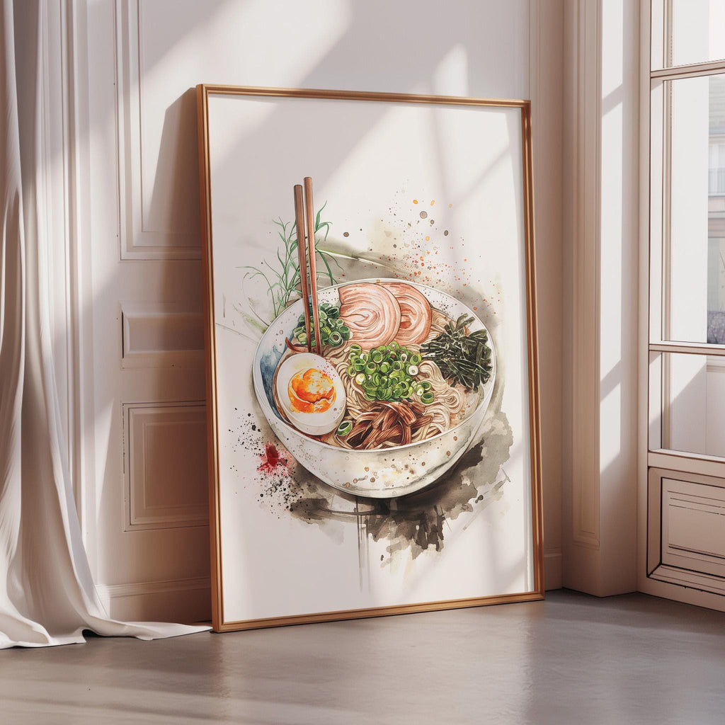 A framed watercolor painting depicting a bowl of ramen noodles with various toppings, including a fried egg, is displayed on a wall in a room with a window.