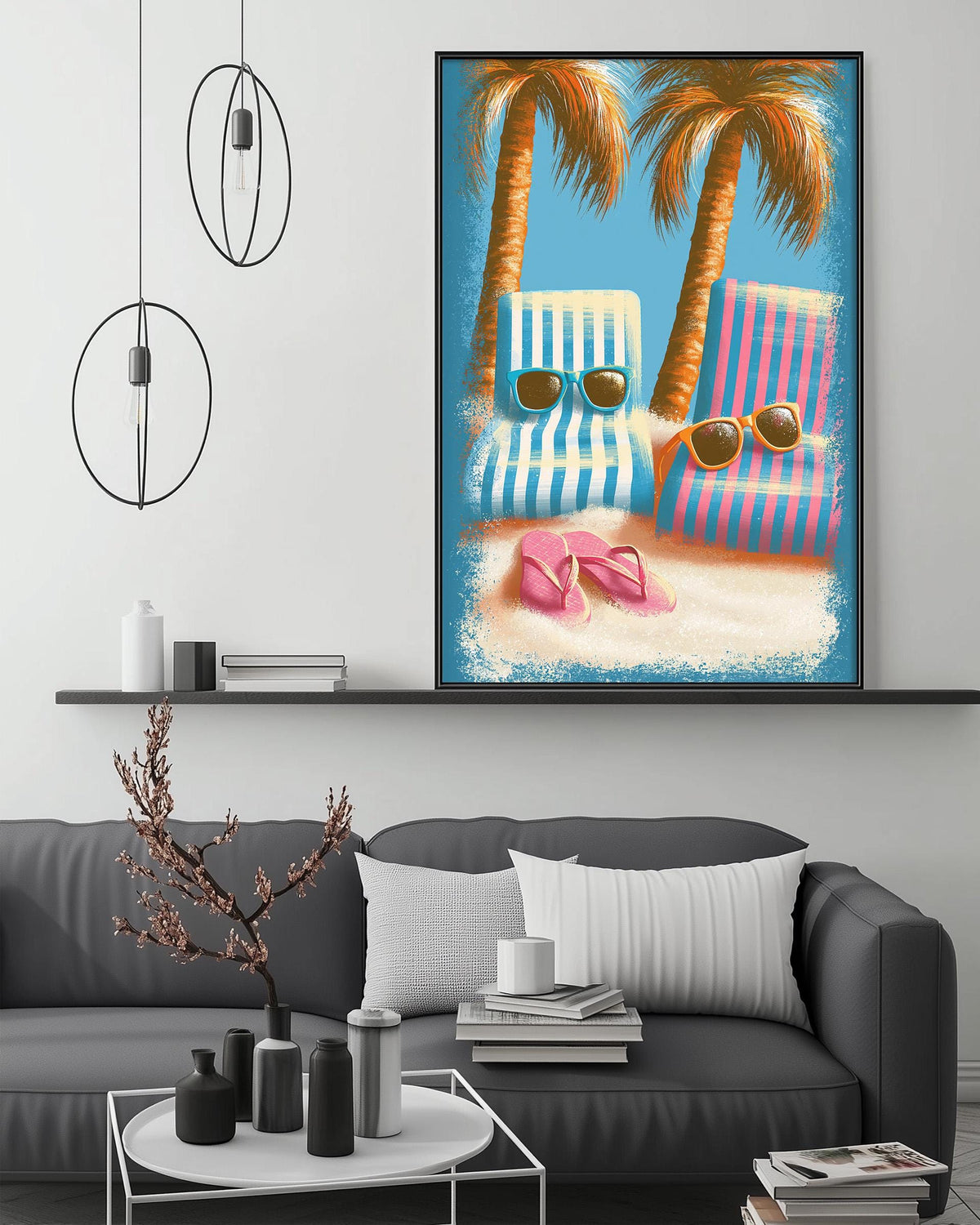 a cozy living room with a gray sofa, a coffee table, and a large framed picture of a beach scene with two striped lounge chairs and a pair of flip-flops on the sand.