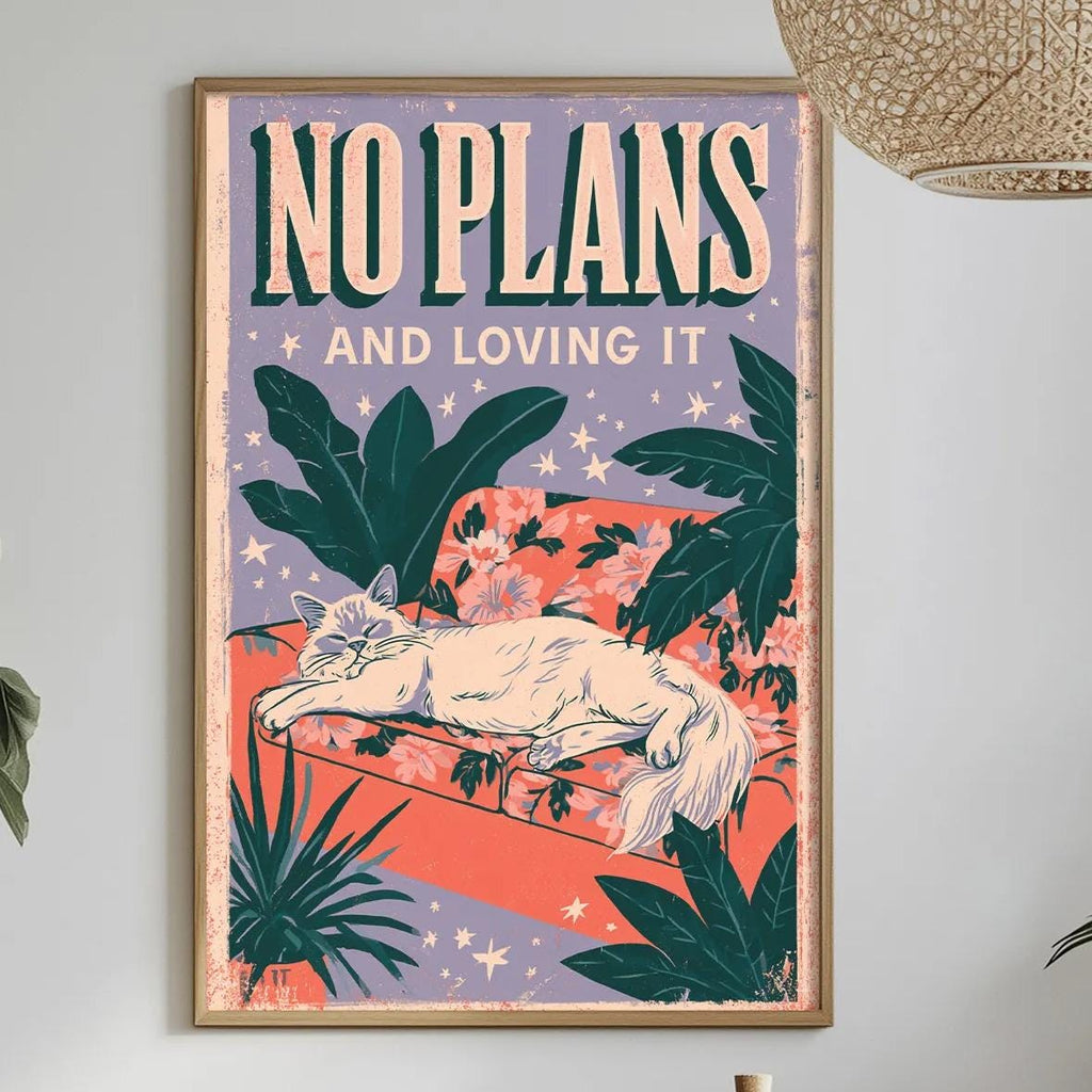 a framed poster with a cat illustration, hanging on a wall above a dining table with various decorative items and plants.
