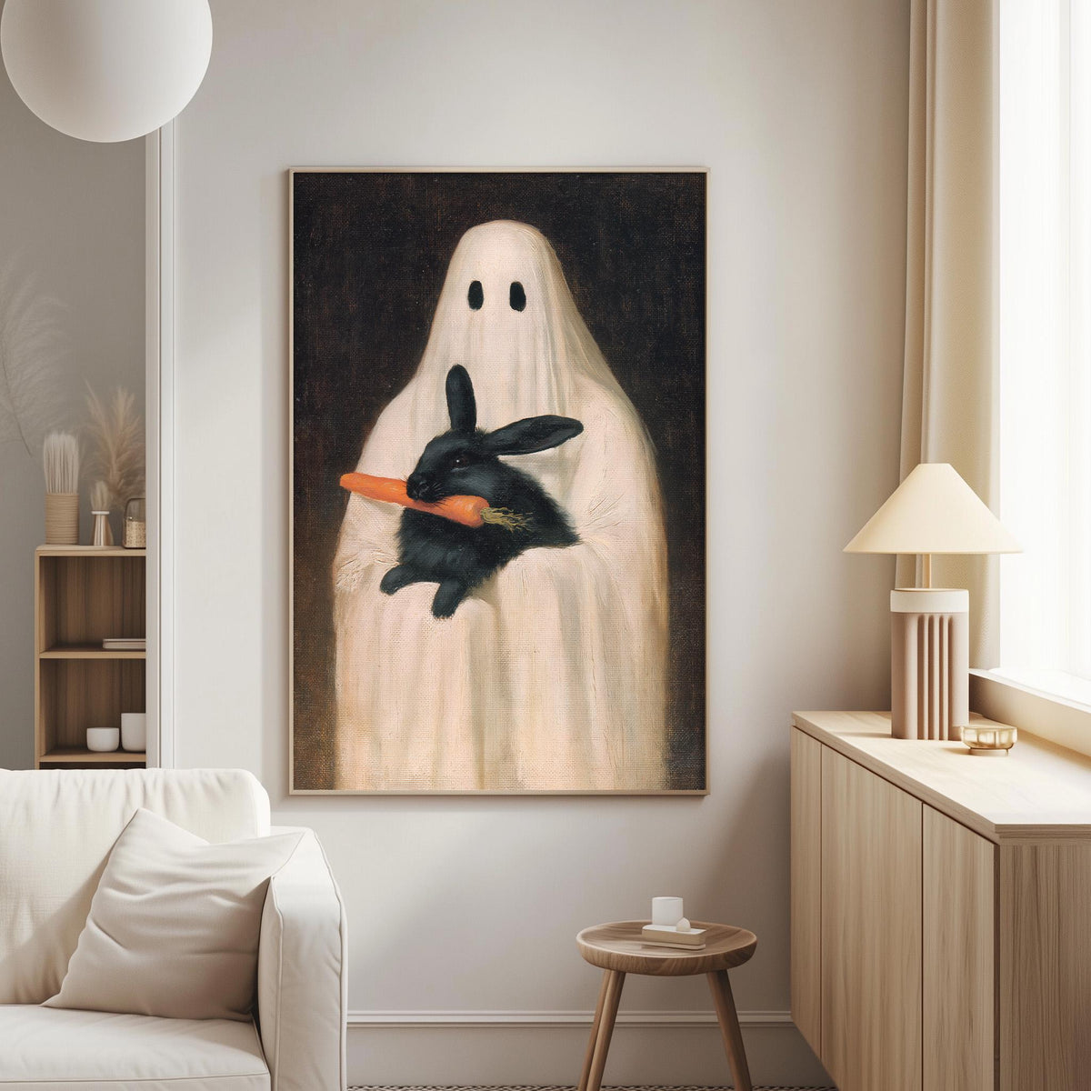 a painting of a ghost holding a black rabbit in its hand, which is hanging on a wall in a living room.