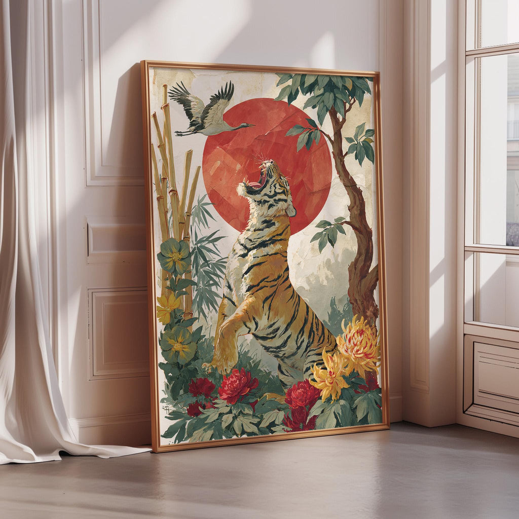 A framed painting depicting a tiger standing in a lush, tropical setting with a large red sun in the background.