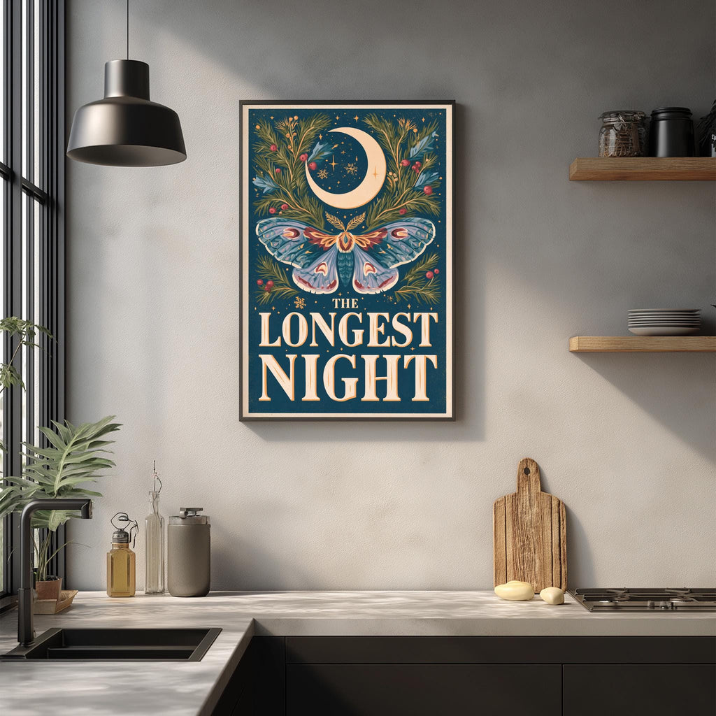 a framed poster with a crescent moon and butterfly design, hanging on a wall above a kitchen counter with various kitchen items and decor.