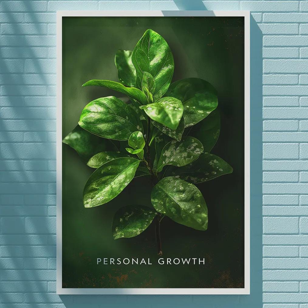 a framed poster with a close-up of green leaves on a blue brick wall, with the text "Personal Growth" below the image.