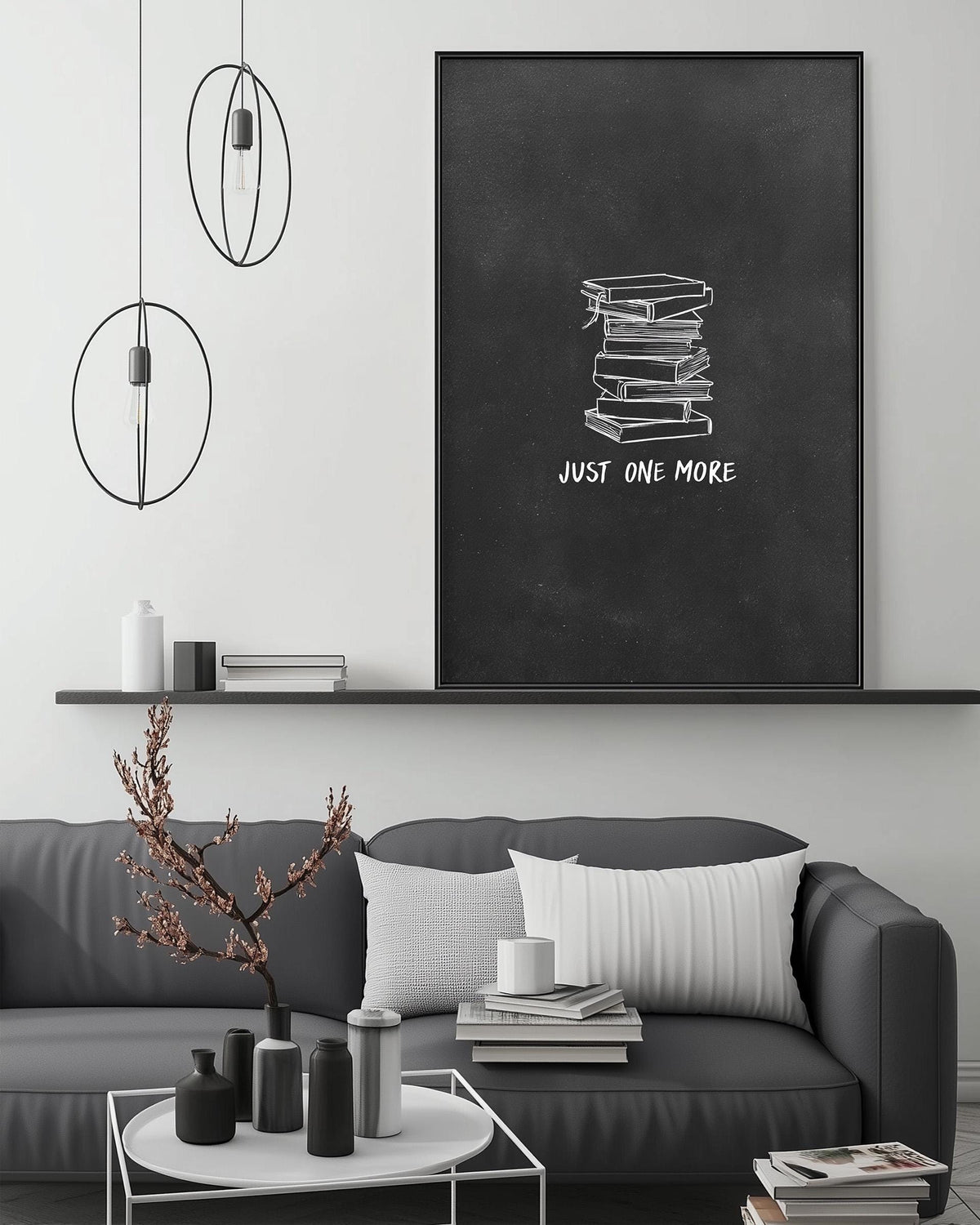 a modern living room with a gray sofa, a coffee table, and a large black and white artwork hanging on the wall above the sofa.