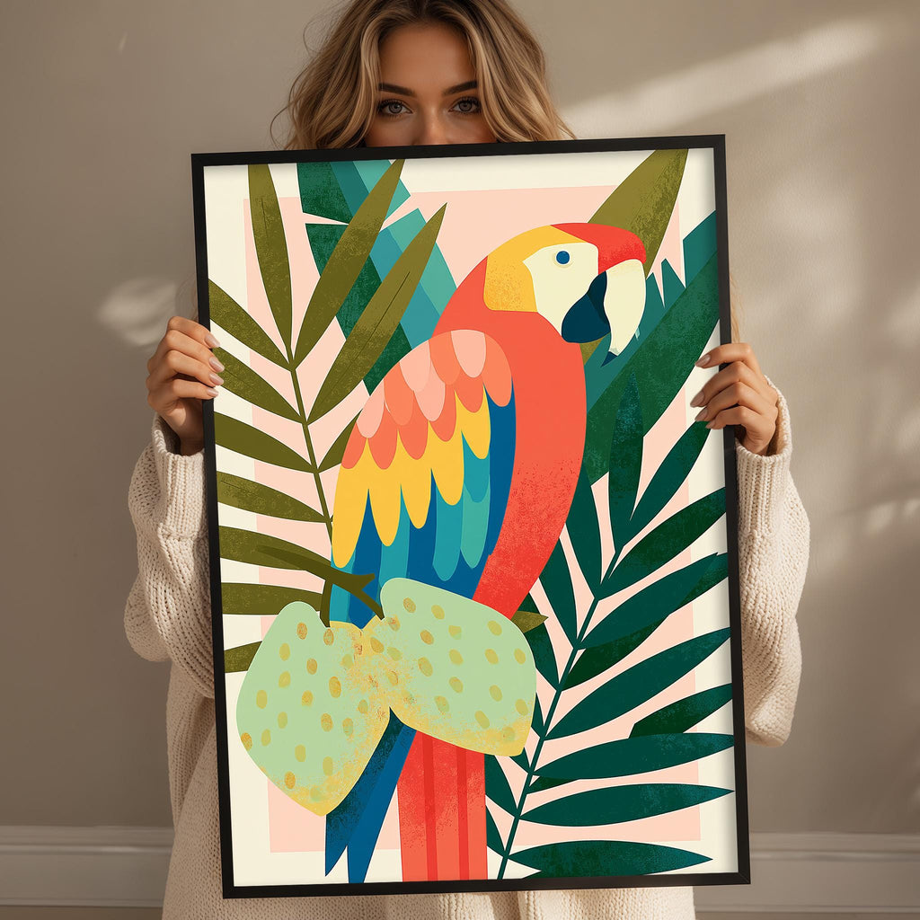 A woman holds up a framed print of a vibrant parrot surrounded by tropical foliage.