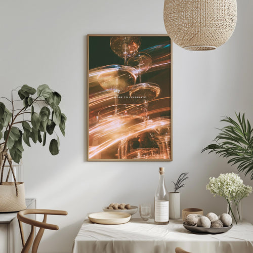 a dining table set with various items, including a bottle, a bowl, and a vase, along with a potted plant and a hanging light fixture.