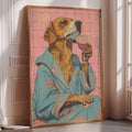 A framed illustration of a dog wearing a blue robe and holding a glass of wine.