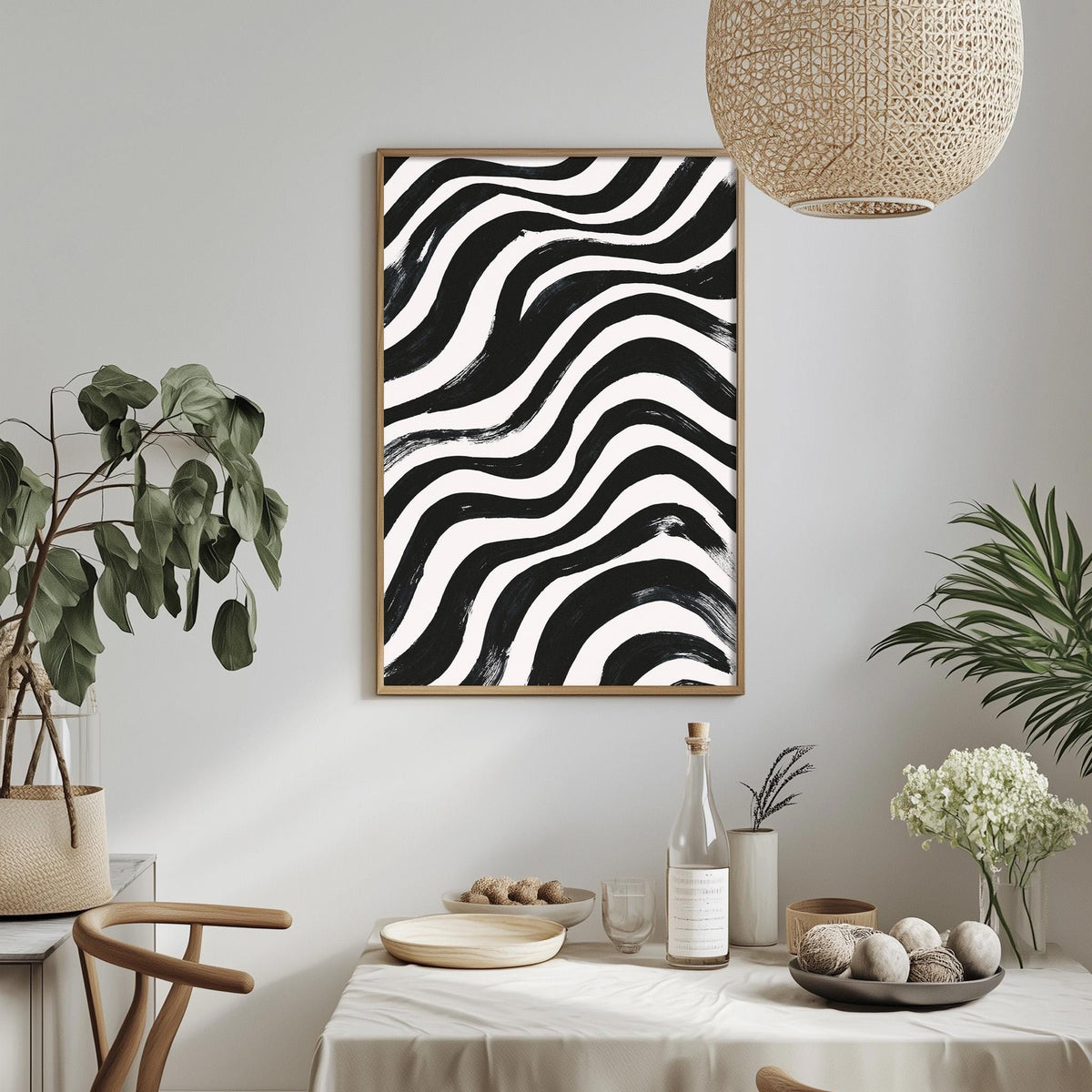 a dining area with a table set for a meal, a potted plant, a hanging light fixture, and a framed abstract artwork on the wall.