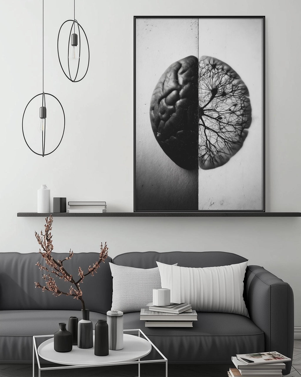 a modern living room with a gray sofa, a coffee table, and a large black and white photograph of a brain on the wall.