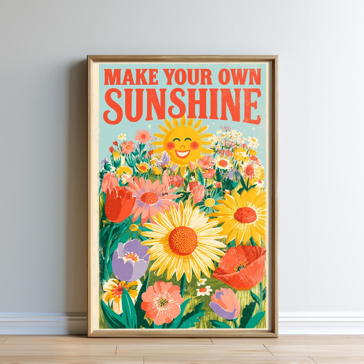 The image is a framed poster with a vibrant illustration of a sunflower surrounded by various colorful flowers. The text on the poster reads "MAKE YOUR OWN SUNSHINE".