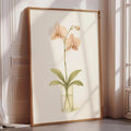 A framed painting of an orchid plant in a vase is displayed on a wall in a room with a window.