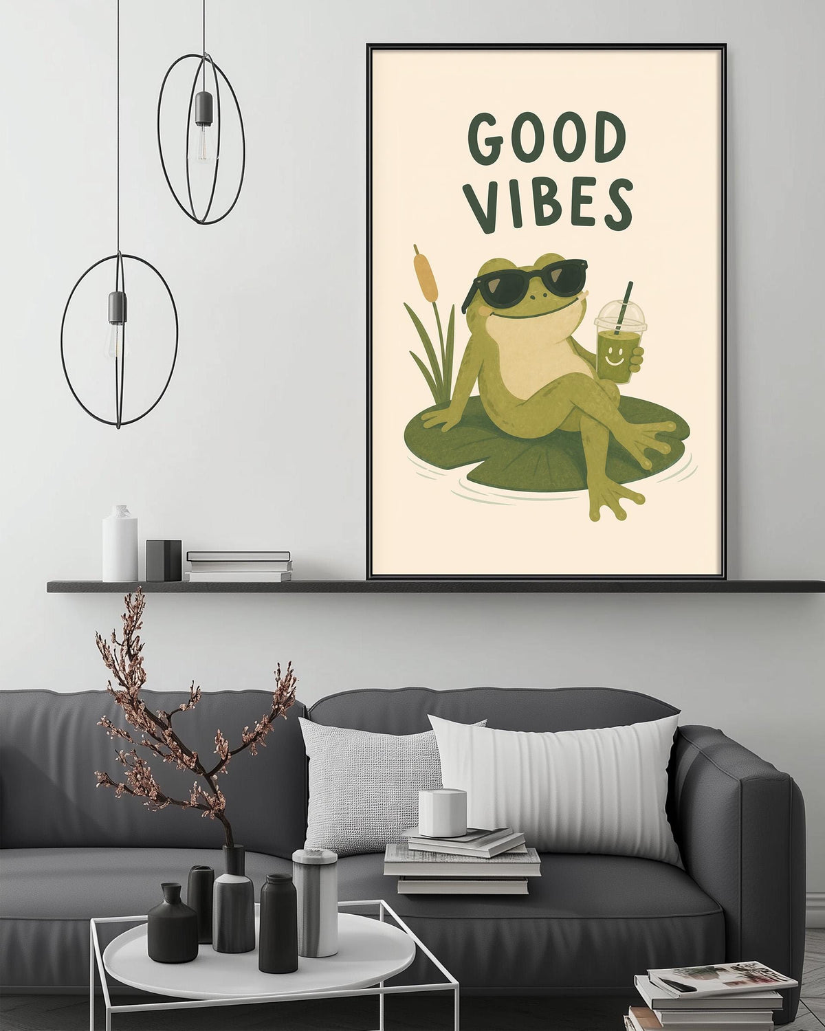 a cozy living room with a gray couch, a coffee table, and a framed poster of a frog sitting on a lily pad with sunglasses and a drink.