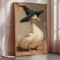 A painting of a duck wearing a black hat, sitting on a wooden surface.