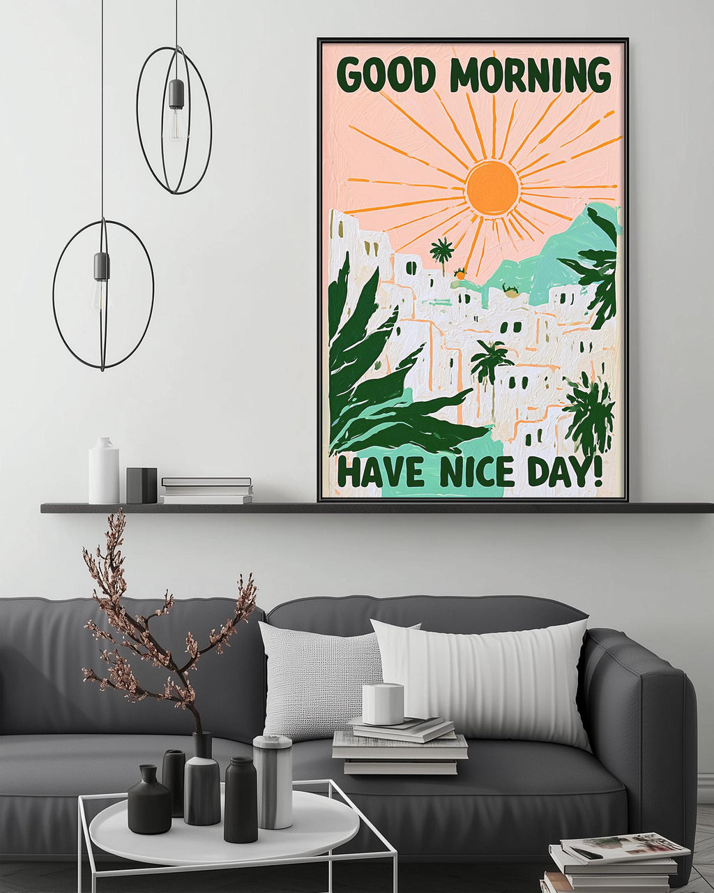 a living room with a gray couch, a coffee table, and a framed poster on the wall. The poster has a tropical landscape with palm trees and a sun, along with the text "GOOD MORNING HAVE NICE DAY!"