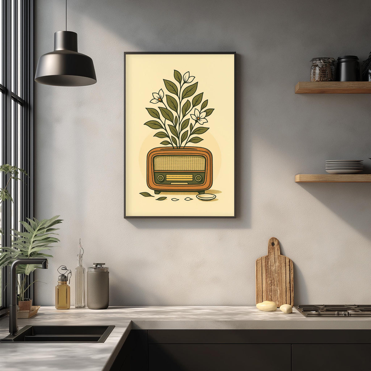 a kitchen counter with various items, including a framed illustration of a radio, a cutting board, and a potted plant.