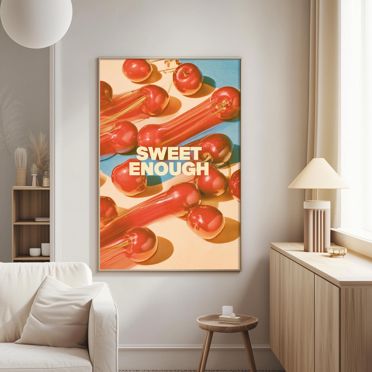 a large framed poster with the text "SWEET ENOUGH" on it, hanging on a wall in a living room.