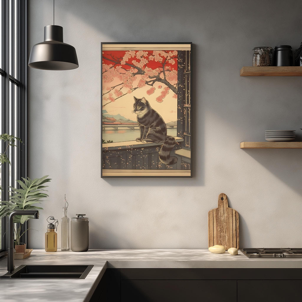 a framed illustration of a cat sitting on a ledge, with a cherry blossom tree in the background. The cat appears to be looking out of a window, and the scene is set against a backdrop of a bridge and mountains.