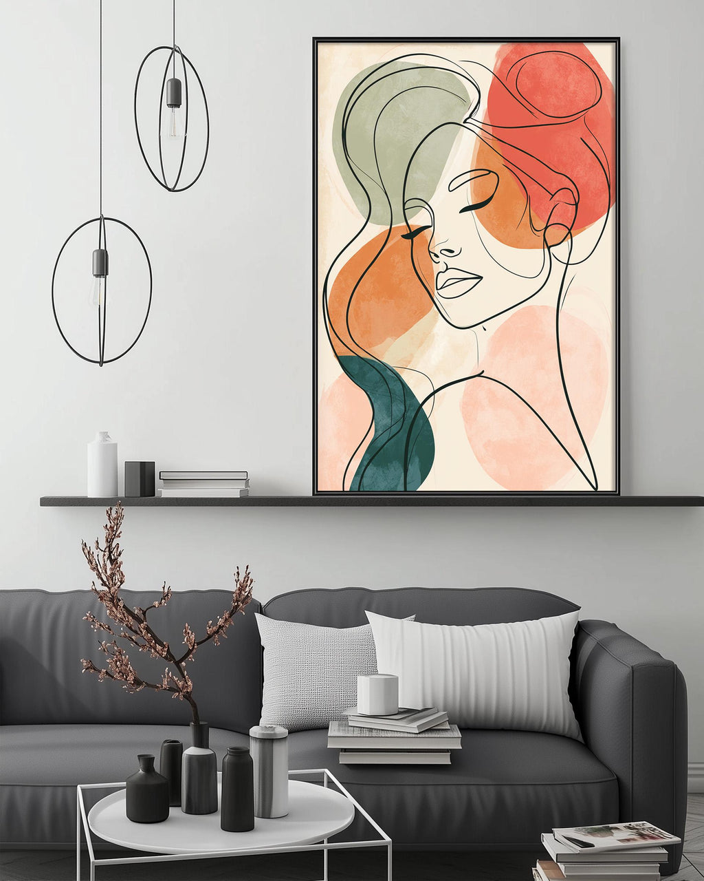 a modern living room with a gray sofa, a coffee table, and a large abstract portrait of a woman's face hanging on the wall above the sofa.