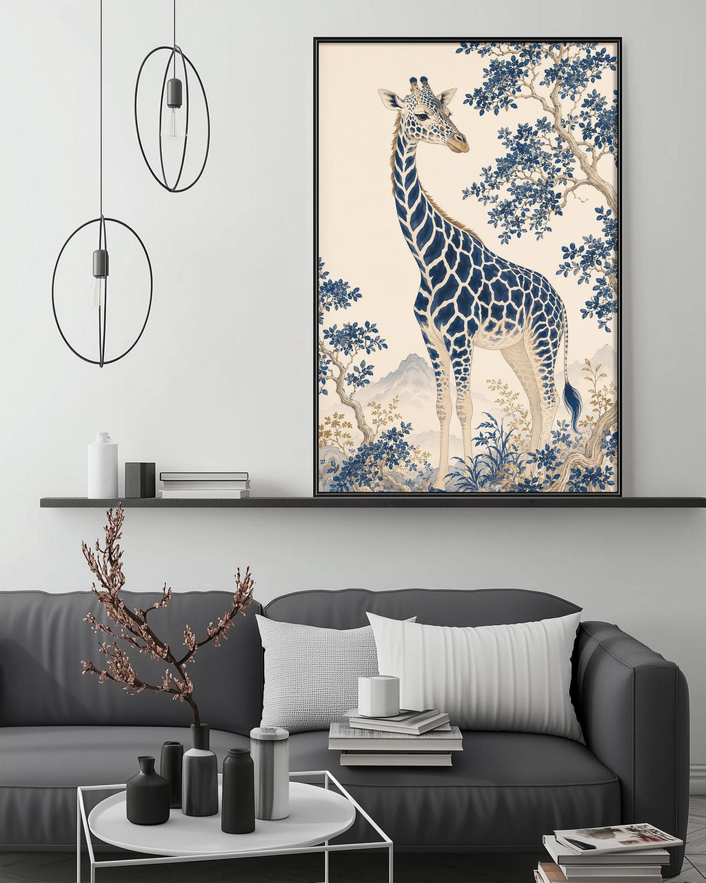 a large framed artwork of a giraffe on a wall above a gray couch with white pillows. The artwork is surrounded by various decorative items, including a potted plant, vases, and books, creating a cozy and stylish living room setting.