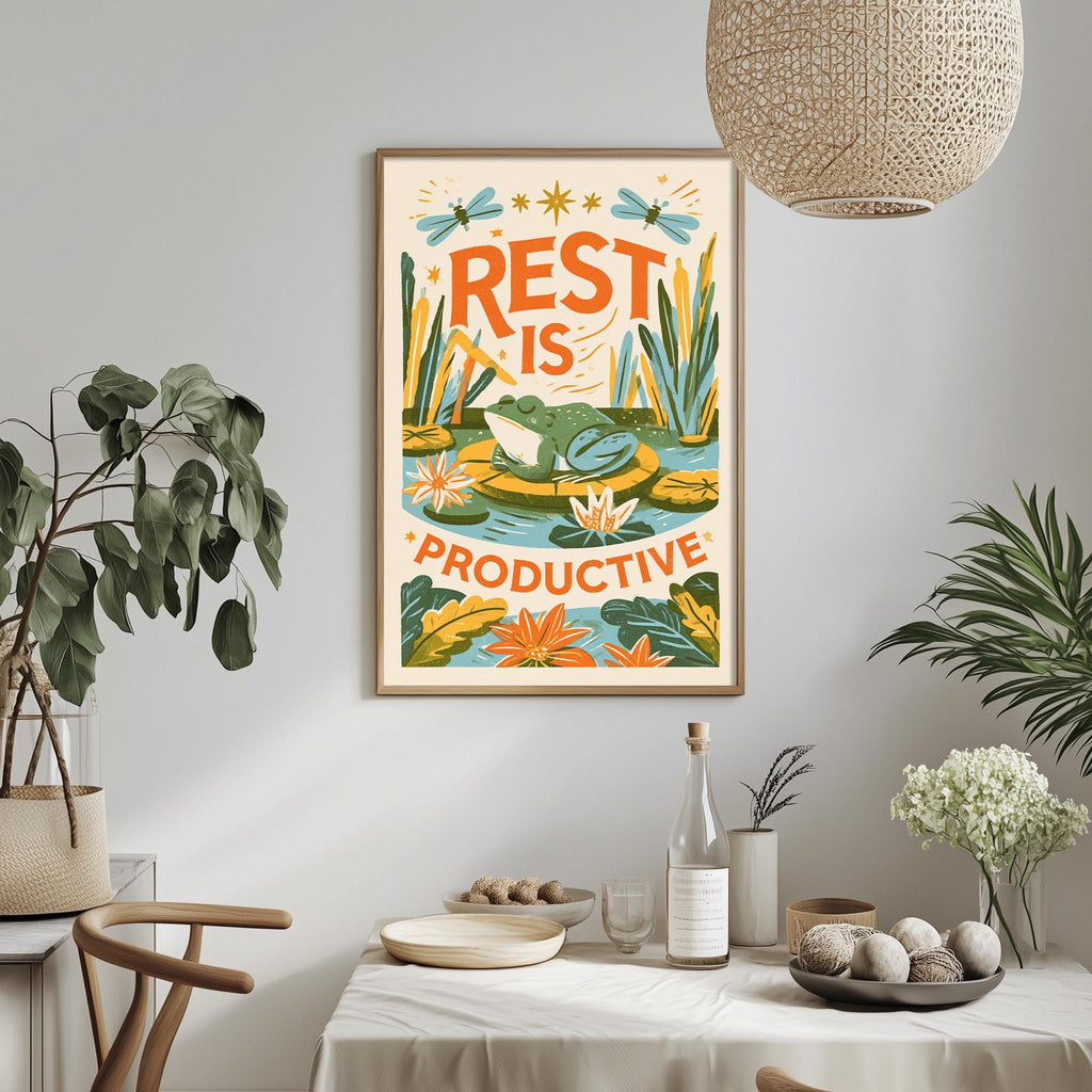 a framed poster with a vibrant illustration of a frog and flowers, hanging on a wall above a dining table with various decorative items and plants.