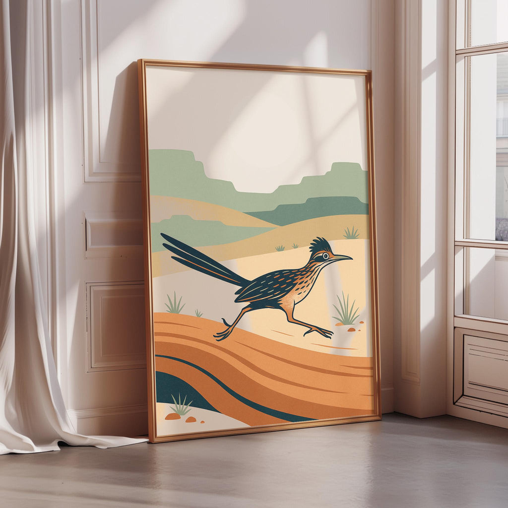 a large, framed poster depicting a bird in mid-flight against a desert landscape with mountains in the background.