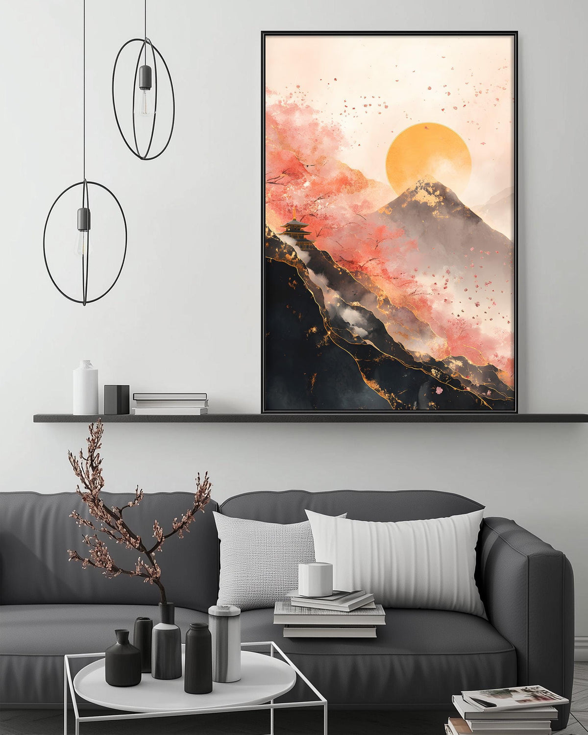 a modern living room with a gray sofa, a coffee table, and a large framed painting of a mountain landscape with a sunset. The painting is hanging on the wall above the sofa, creating a focal point in the room.