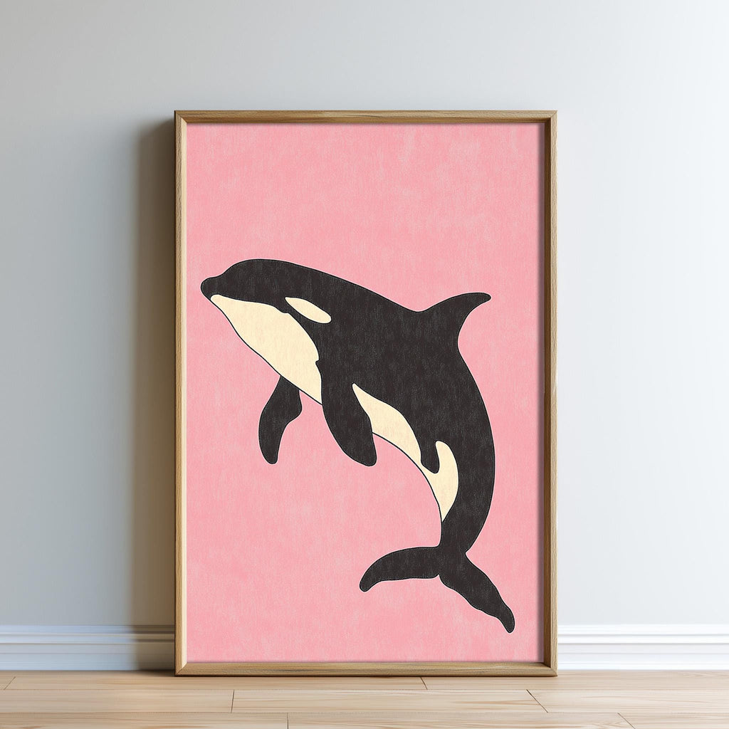A framed illustration of a black and white orca whale against a pink background.