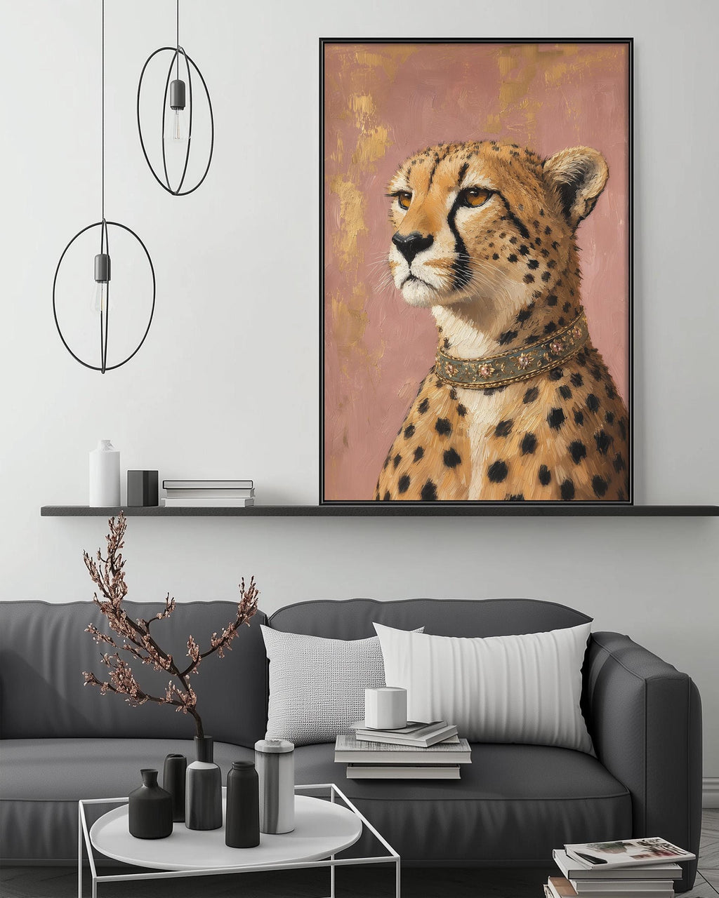 a large framed painting of a cheetah on a wall above a gray couch with a coffee table in front of it. The painting is hanging above a shelf with various decorative items, and there are pendant lights hanging from the ceiling.
