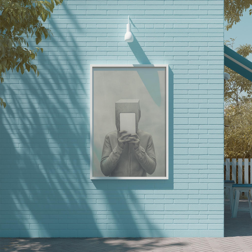 a person holding a box in front of their face, with a blue brick wall and a tree in the background.