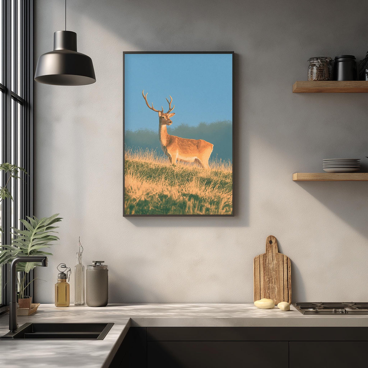 a framed photograph of a deer standing in a grassy field, with a wooden cutting board and other kitchen items visible in the foreground.