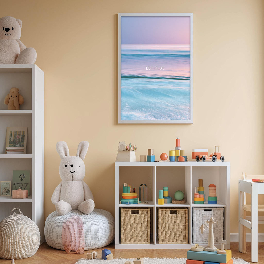 A cozy children's room with a white bookshelf, a plush rabbit, and a colorful toy box filled with toys. Above the bookshelf, there is a framed poster with a serene beach scene and the text "LET IT BE".