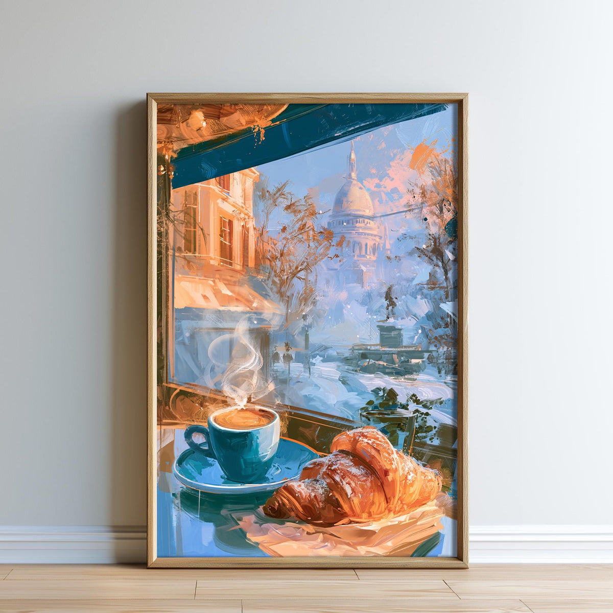 A framed painting depicting a cozy scene of a cup of coffee and a croissant, with a cityscape visible through a window in the background.