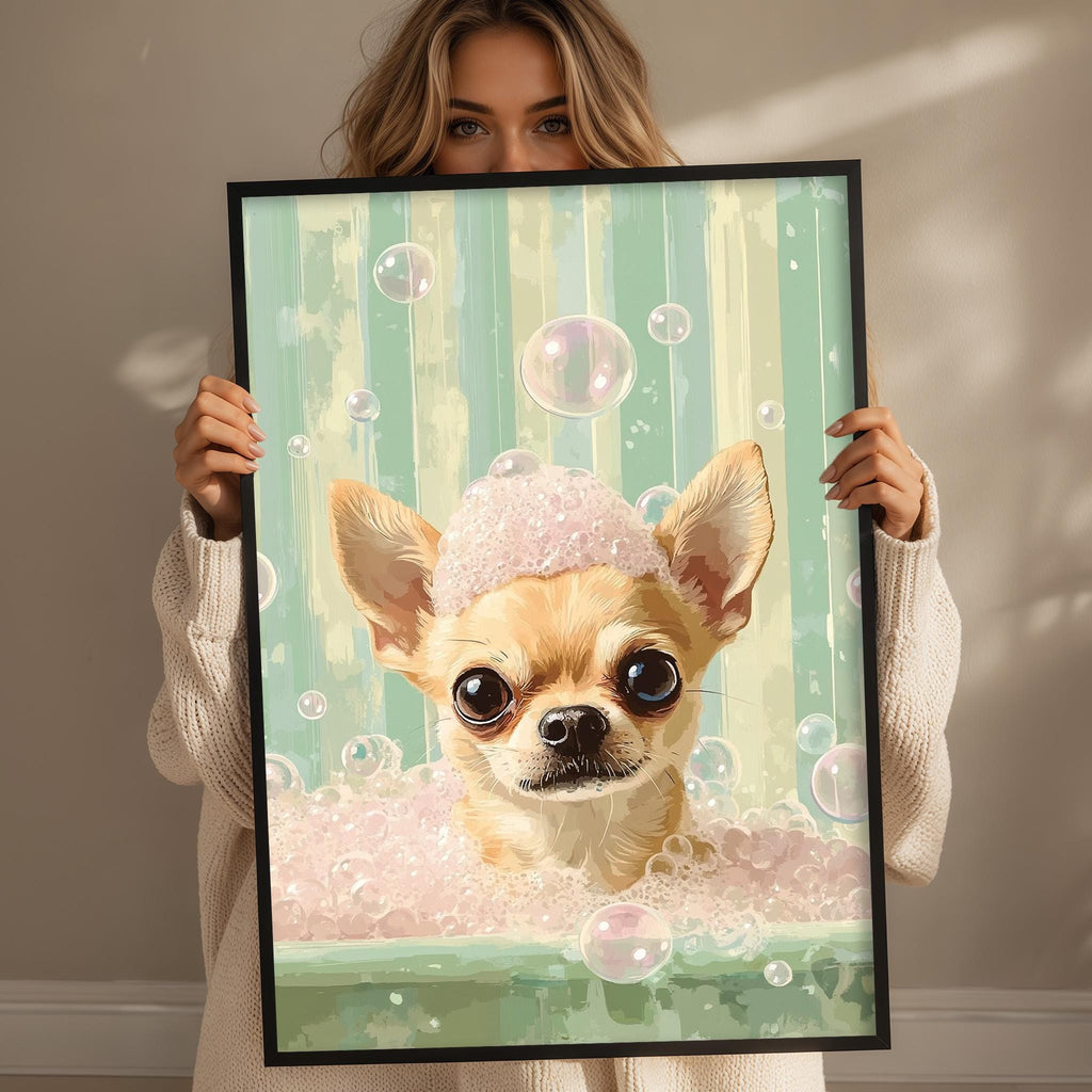 A woman holds up a framed painting of a small dog in a bathtub filled with bubbles.