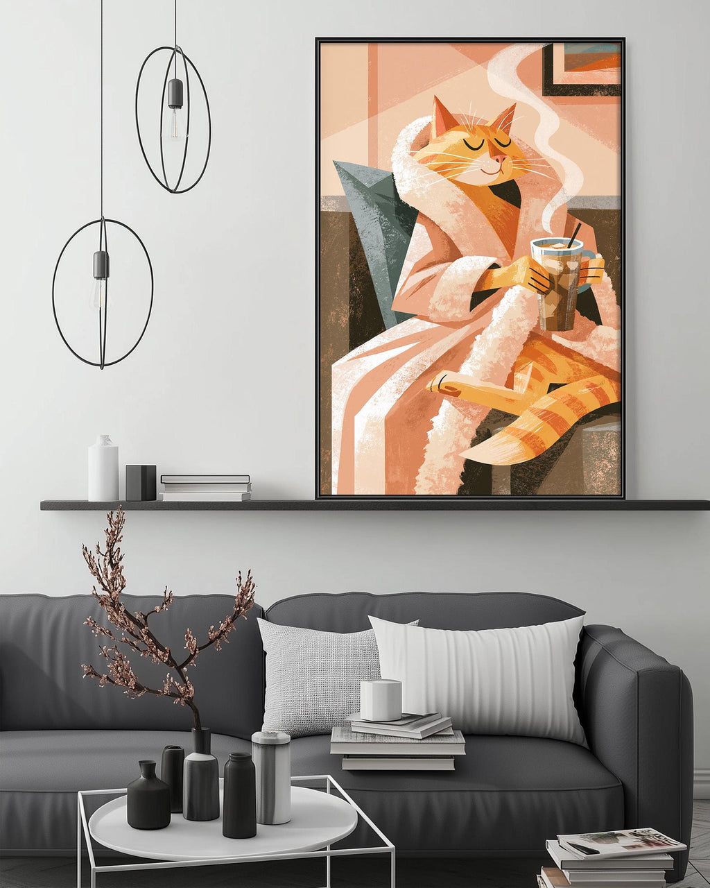 a cozy living room with a gray sofa, a coffee table, and a large framed illustration of a cat in a robe holding a cup of tea. The room has a minimalist and modern design, with a pendant light hanging above the sofa and a shelf displaying decorative items.