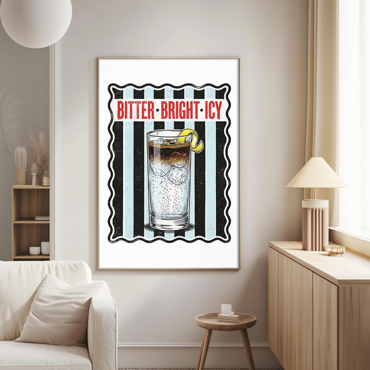 a framed poster of a glass of iced tea with a lemon, displayed on a wall in a living room setting.