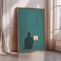 a large framed poster with a silhouette of a person sitting in front of a green background.