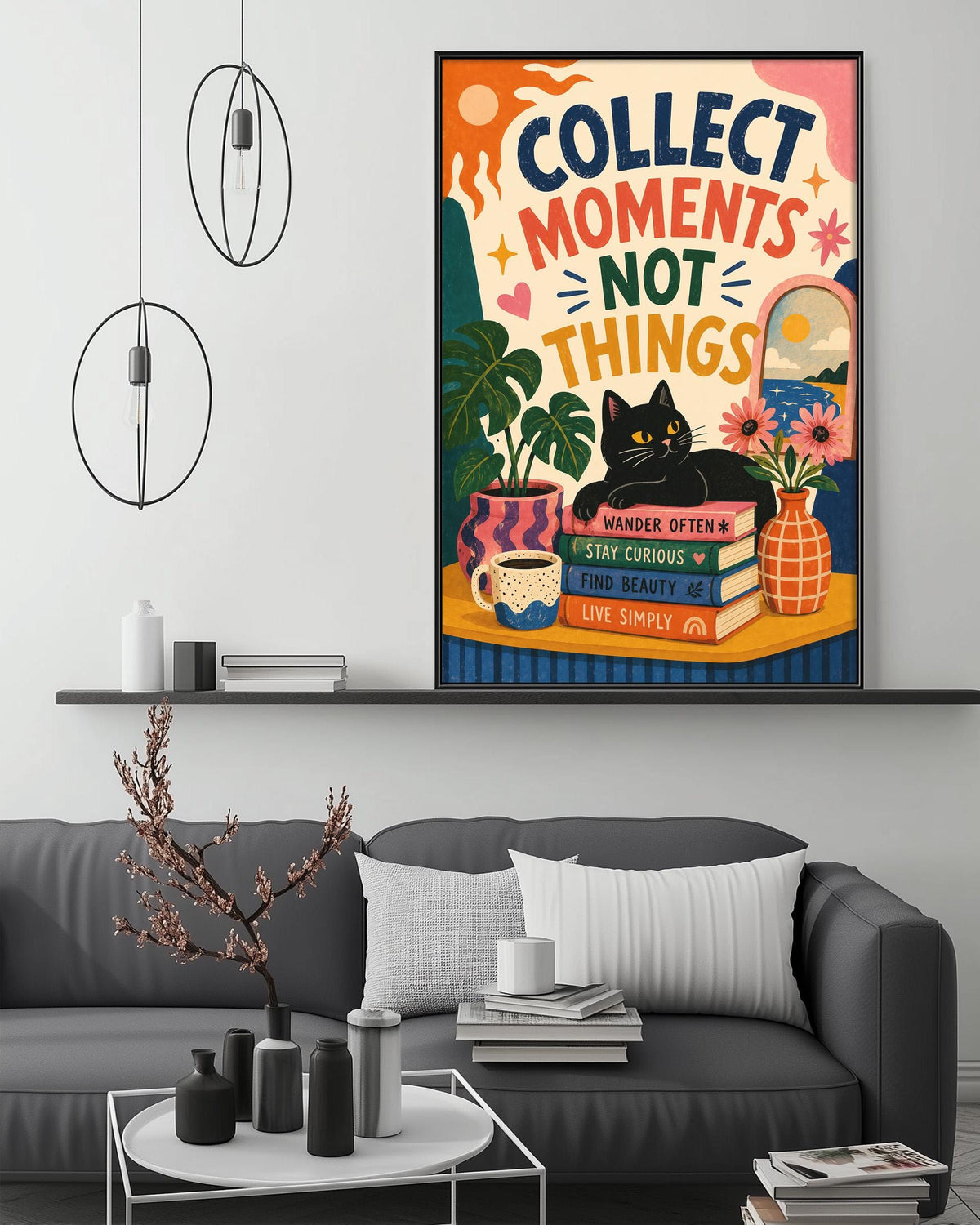 a colorful poster with the text "Collect moments not things" and an illustration of a cat, books, and plants. The poster is displayed on a wall above a gray couch in a living room setting.