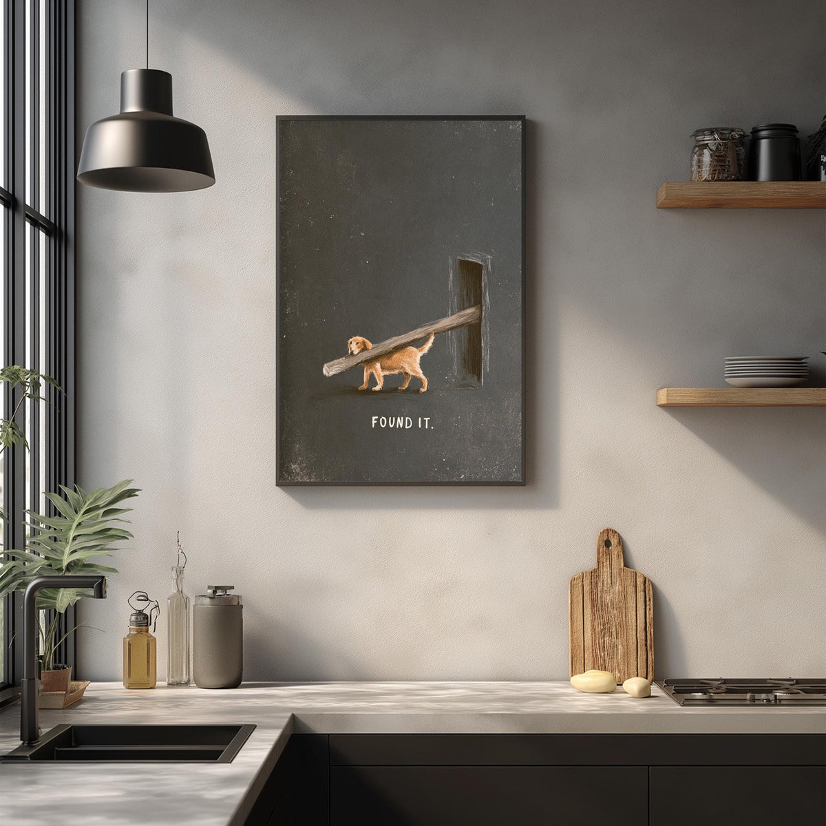 a kitchen counter with various kitchen items, including a cutting board, a bottle, and a plant. Above the counter, there is a framed image depicting a dog carrying a stick with the text "FOUND IT" written on it.